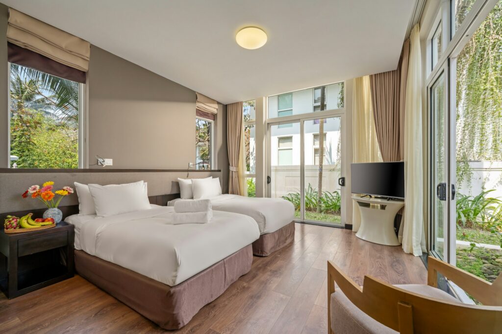 Twin-bed guest room with garden windows