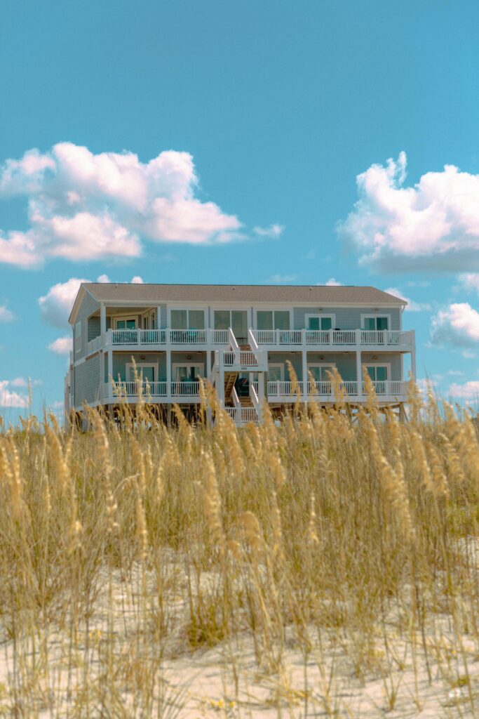 Raised beach house behind the dune grasses
