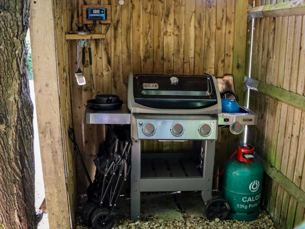 Gas grill in a sheltered outdoor nook