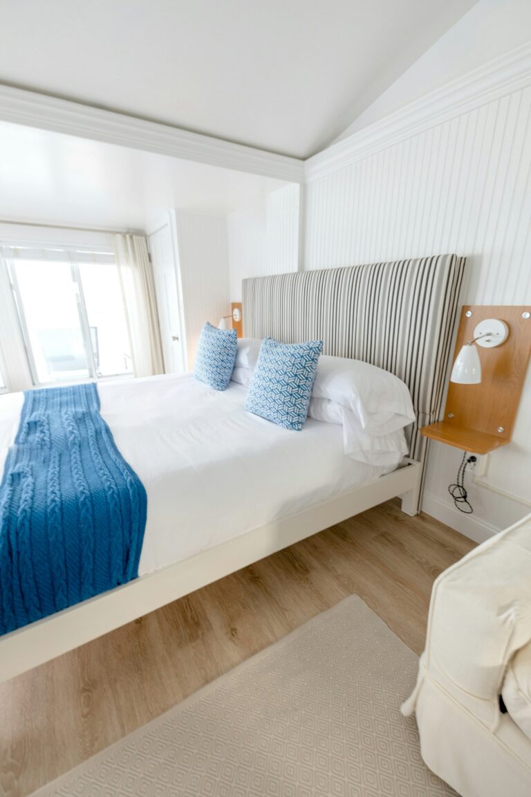King bedroom with navy and white linens