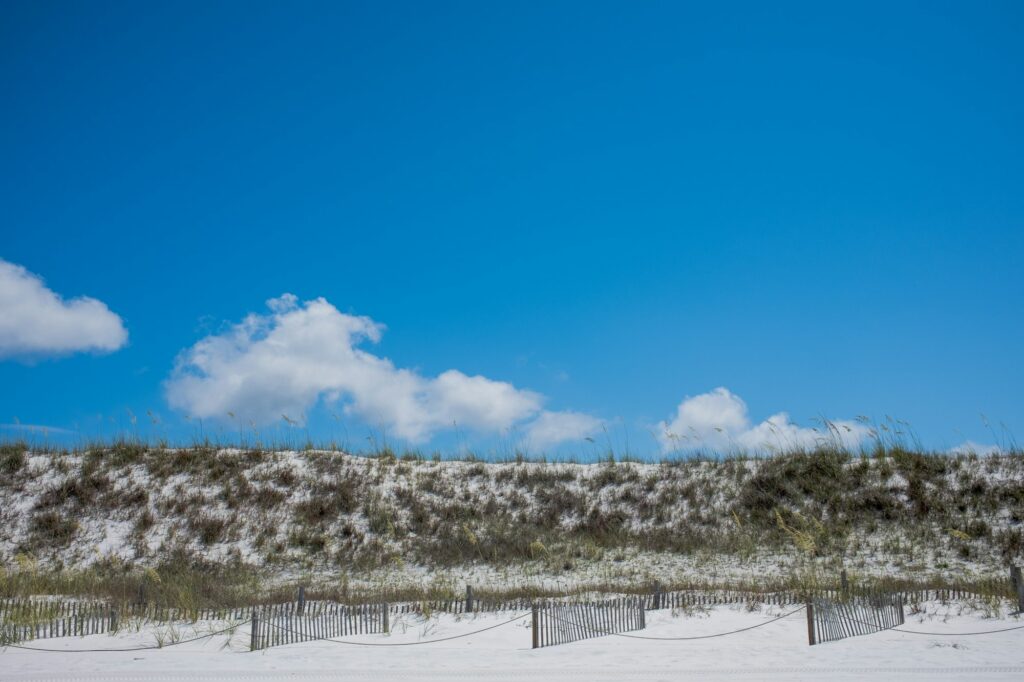 White sand dunes under a blue sky